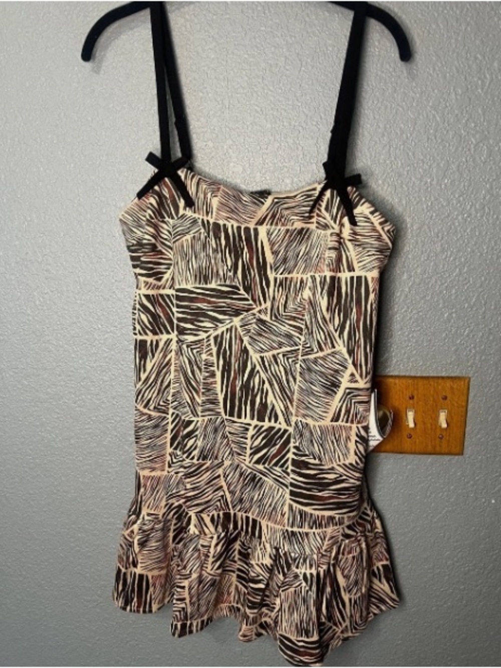 Sleeveless Ruffle-Hem Mini Dress in Beige and Black